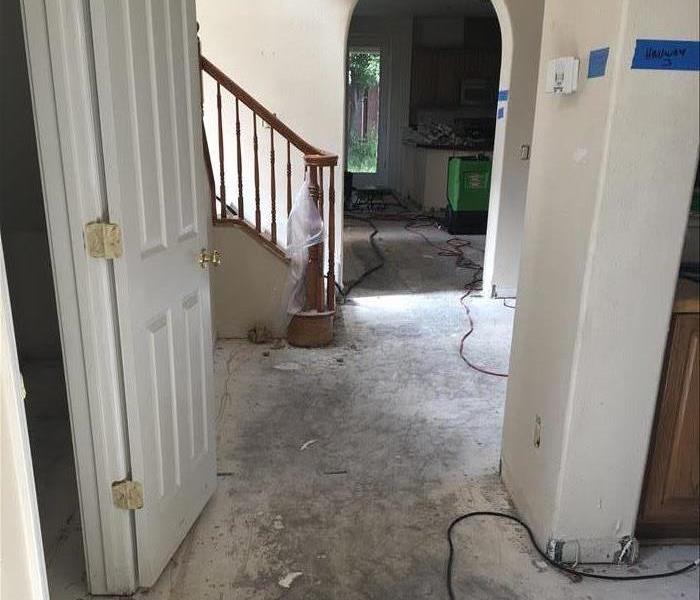 residential hallway with flooring removed